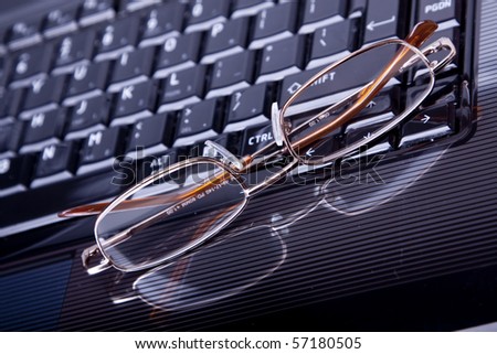 Business theme with laptop, glasses