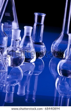 Chemistry equipment, laboratory glassware on blue background