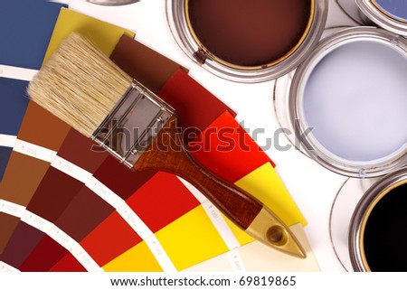 Paints, color picker and paint cans on white background