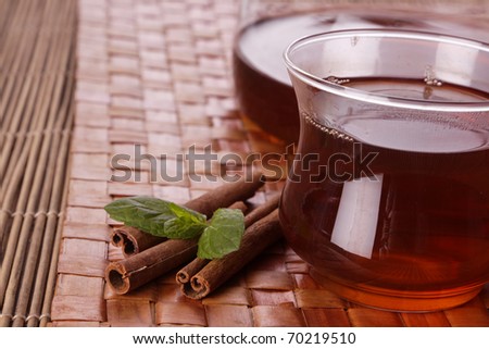 Tea time! Closeup of hod delicious tea on mat