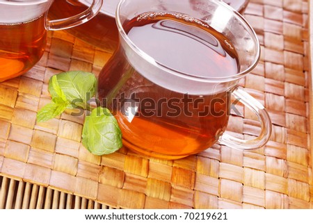 Tea time! Closeup of hod delicious tea on mat