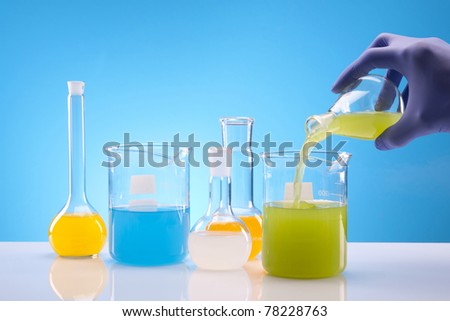 Scientist Experimenting with fluids in laboratory