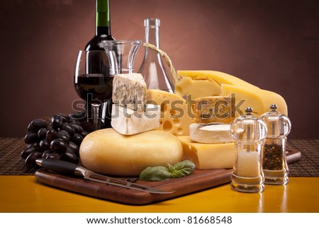Delicious Cheese decoration, wine and grapes! Perfect composition of taste