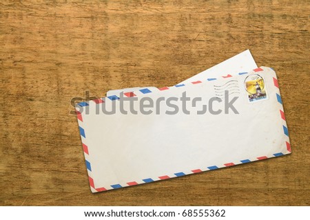 The old letter on the wood background