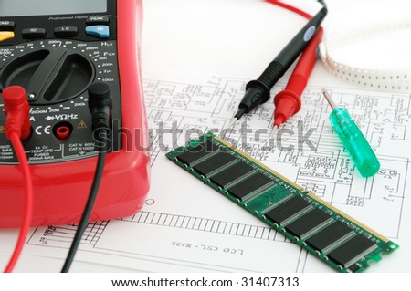 A memory card, electric s?heme, multimeter in the test laboratory
