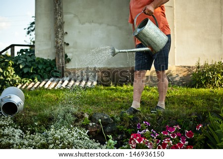 Man with watering-cans