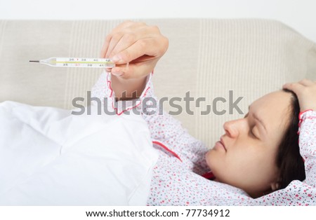 Young woman shows her body temperature, see similar pictures in my portfolio