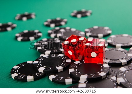dice with black ships on casino table