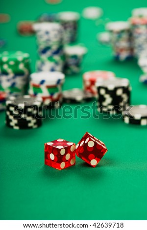 dice among chips on casino table