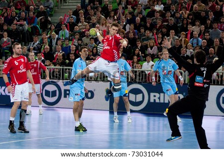 LJUBLJANA, SI - MARCH 9: Slovenian handball players (blue) play a match against Poland in qualification for handball ehf euro 2012 in Serbia on March 9, 2011 in Ljubljana, Slovenia.