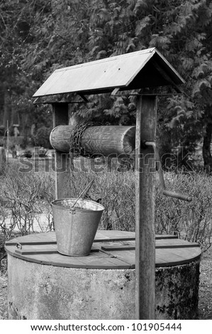 Old well for water on a cemetery (B&W)