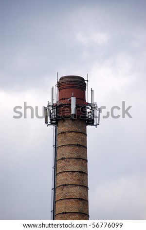 factory chimney against the grey sky