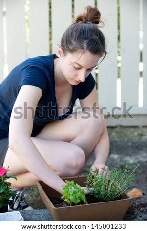 Vertical of woman planting plants