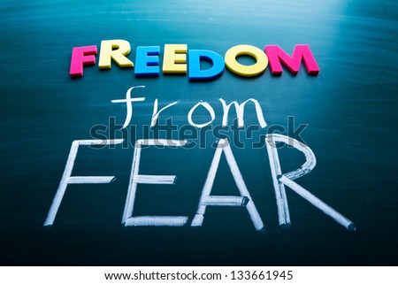 Freedom from fear, colorful conceptual words on blackboard.