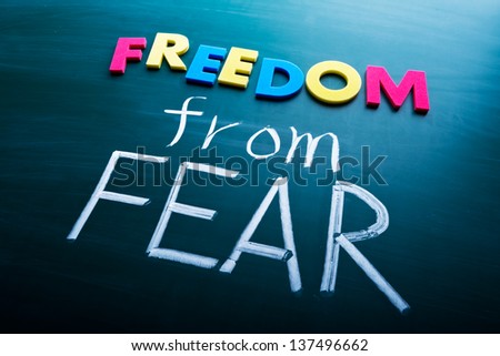 Freedom from fear, colorful conceptual words on blackboard.
