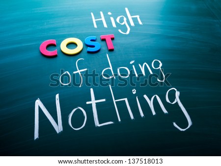 High cost of doing nothing, conceptual words on blackboard