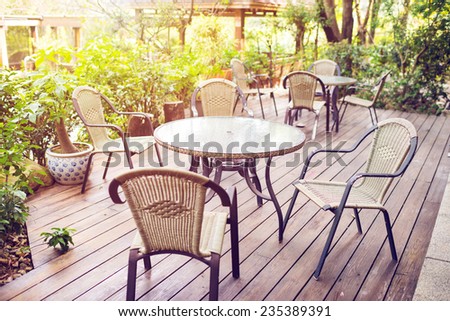 Tables and chairs of cafeteria outside in garden