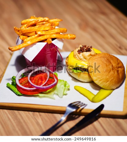 A delicious meal set of hamburger, chips and drink