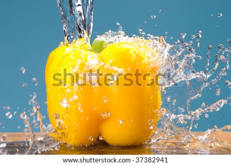 concept of fresh vegetable, splash and yellow bell pepper