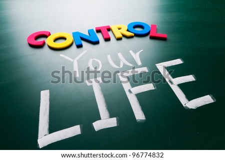 Control your life, colorful conceptual words on blackboard.