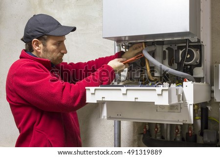 plumber who carries out the maintenance of a condensing boiler