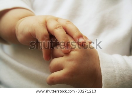 Beautiful little hands of the sleeping baby