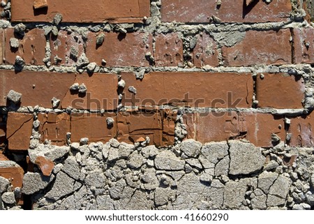 Old red brick wall with the fallen off plaster. Background