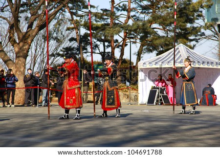 SEOUL, SOUTH KOREA - MARCH 22: Unidentified men perform a traditional martial art show at the park in front of N Seoul Tower on March 22, 2012 in Seoul, Korea.