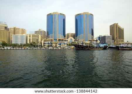 DUBAI, UAE - MARCH 24: Deira Twin Towers in Dubai Creek March 24,2013. Twin Towers are constructed in 1998 and height of each building is 102 m.