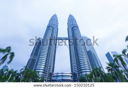 KUALA LUMPUR - APRIL 28: View of The Petronas Twin Towers on April 28,2013 in Kuala Lumpur, Malaysia. It is famous landmark of Malaysia. Petronas Twin Towers are the tallest twin buildings in the world (451.9 m).