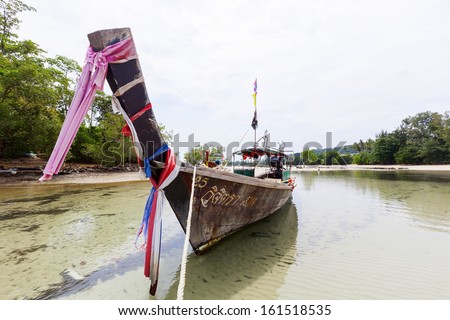 KRABI, THAILAND - JULY 7 : Traditional shuttle service longtail boat serves for the tourist for sightseeing the islands on July 7,2013 in Krabi ,Thailand.