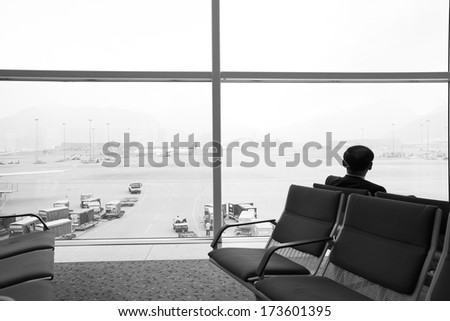 HONG KONG, CHINA -NOV 7: Passengers waiting in Hong Kong airport on November 7, 2013 in Hong Kong, China. Hong Kong airport handles more than 55 million passengers per year