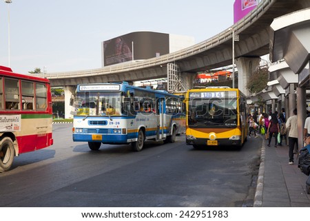 BANGKOK, THAILAND - JAN 3 : Public transport bus stop at Victory monument with skytrain track on background on Jan 3,2015.