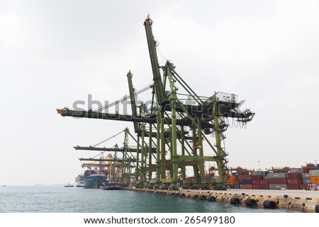 SINGAPORE- MAR 22 : Singapore commercial port on March 22,2015 in Singapore. It\'s the world\'s busiest port in terms of total shipping tonnage, it transships a fifth of the world shipping containers.