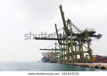 SINGAPORE- MAR 22 : Singapore commercial port on March 22,2015 in Singapore. It\'s the world\'s busiest port in terms of total shipping tonnage, it transships a fifth of the world shipping containers.