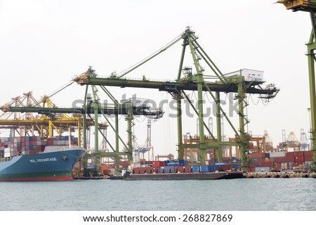 SINGAPORE - MAR 22 : Singapore industrial port on March 22,2015 in Singapore. It is the world\'s busiest port in terms of total shipping tonnage, it transships fifth of the world\'s shipping containers.