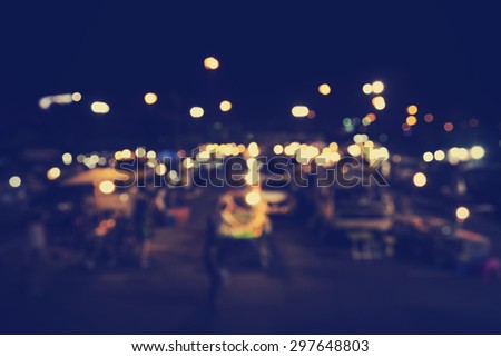 Blur image of tourists walk in night market