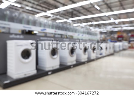 blurred image of washing machines in the store