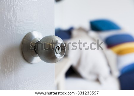 half opened bedroom door with door knob
