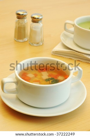fresh clear soup in a white bowl