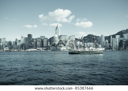HONG KONG - JULY 5 : Ferry cruising Victoria harbor with Hong Kong skyline in the background on July 5, 2011 in Hong Kong, China. The ferry company has been in operation for more than 120 years.