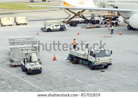 SINGAPORE - SEPTEMBER 5: Cargo is delivered to an aircraft at Changi airport on September 5,2011 in Singapore. Changi Airport is the 18th busiest airport in the world and the 5th busiest in Asia.