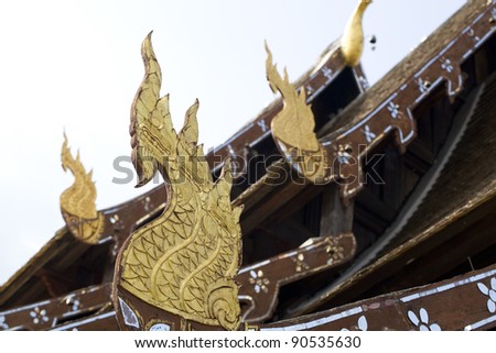 Gable apex in temple roof with blue sky background