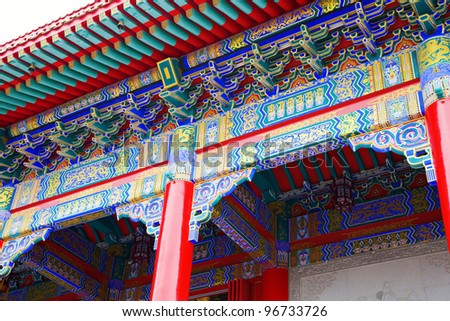 detail view of chinese old palace, with colorful details of wooden facade