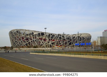 BEIJING - MARCH 22. Bird\'s nest stadium at day time on March 22, 2012. The Bird\'s Nest is a stadium in Beijing, China. It was designed for use throughout the 2008 Summer Olympics and Paralympics.