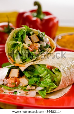 Chicken and vegetable fajitas in tortillas Mexican style