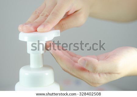 Putting whip foam soap on the hand