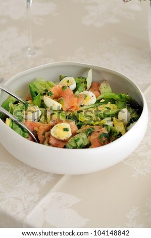 Smoked salmon salad, with mixed greens, avocado and  Quail Eggs. Delicious healthy eating.