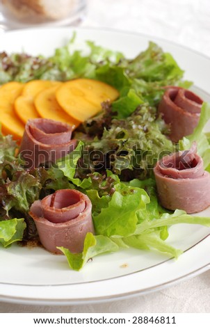 Mixed salad leaves with persimmon and smoked duck breast