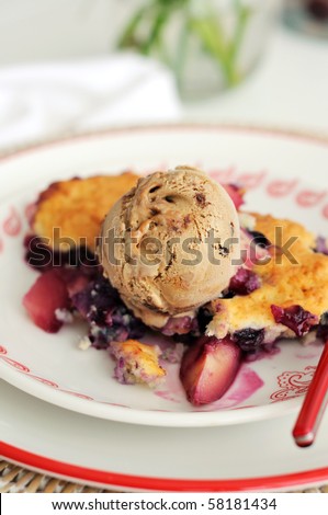 Homemade Peach and Blueberry soured cream cobbler with ice cream